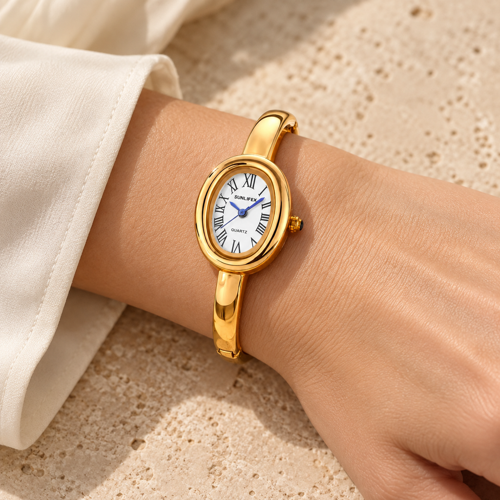 Aurelia Bracelet Watch in Gold worn with an ivory blouse