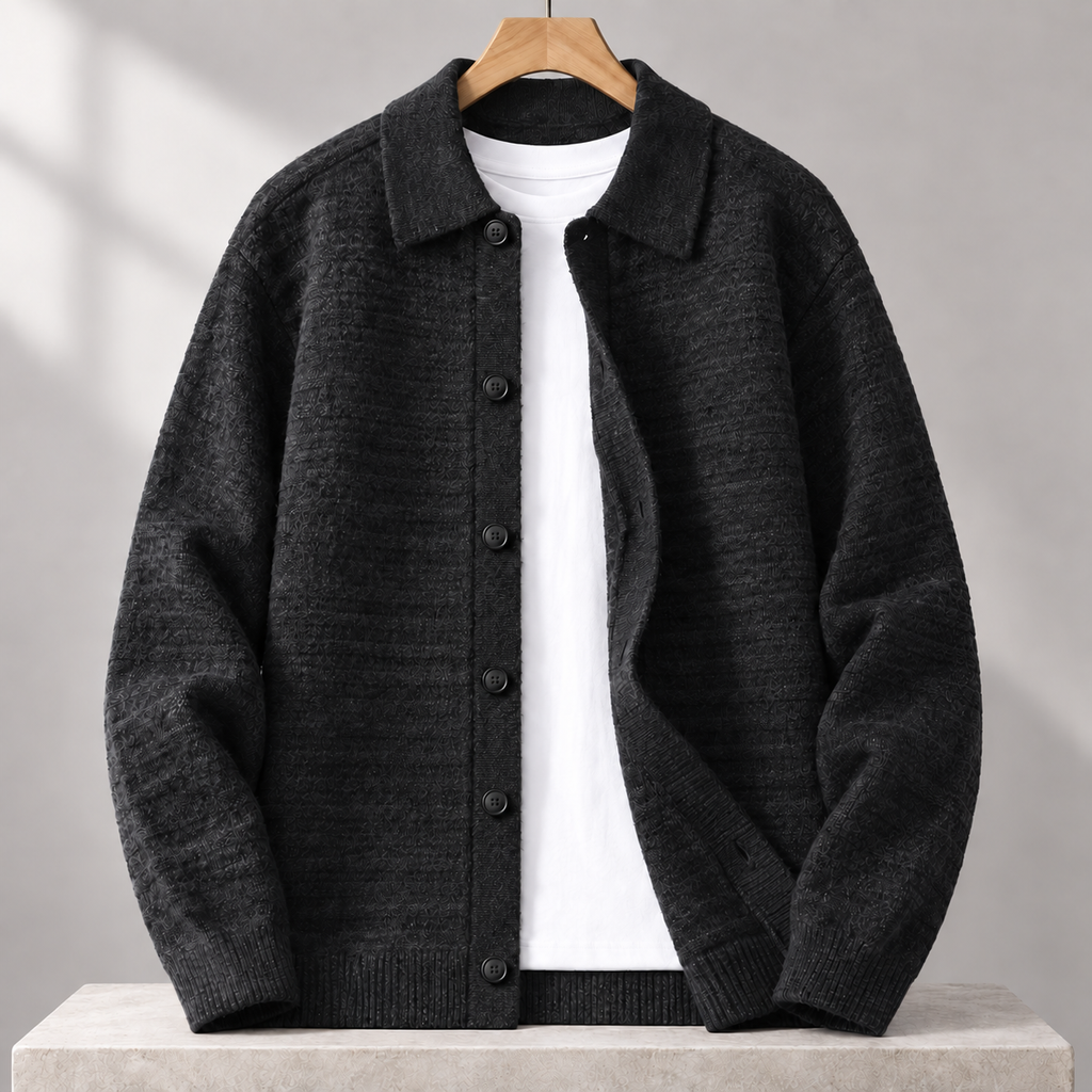 Cesare Waffle-Knit Cardigan in Onyx Black on a wooden hanger