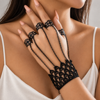 Noemi Hand Chain worn, showing five black filigree rings, fine chains and scalloped lace cuff