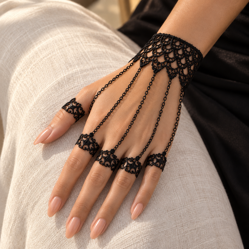 Noemi Hand Chain worn on a relaxed hand against ivory linen