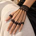 Noemi Hand Chain worn on a relaxed hand against ivory linen