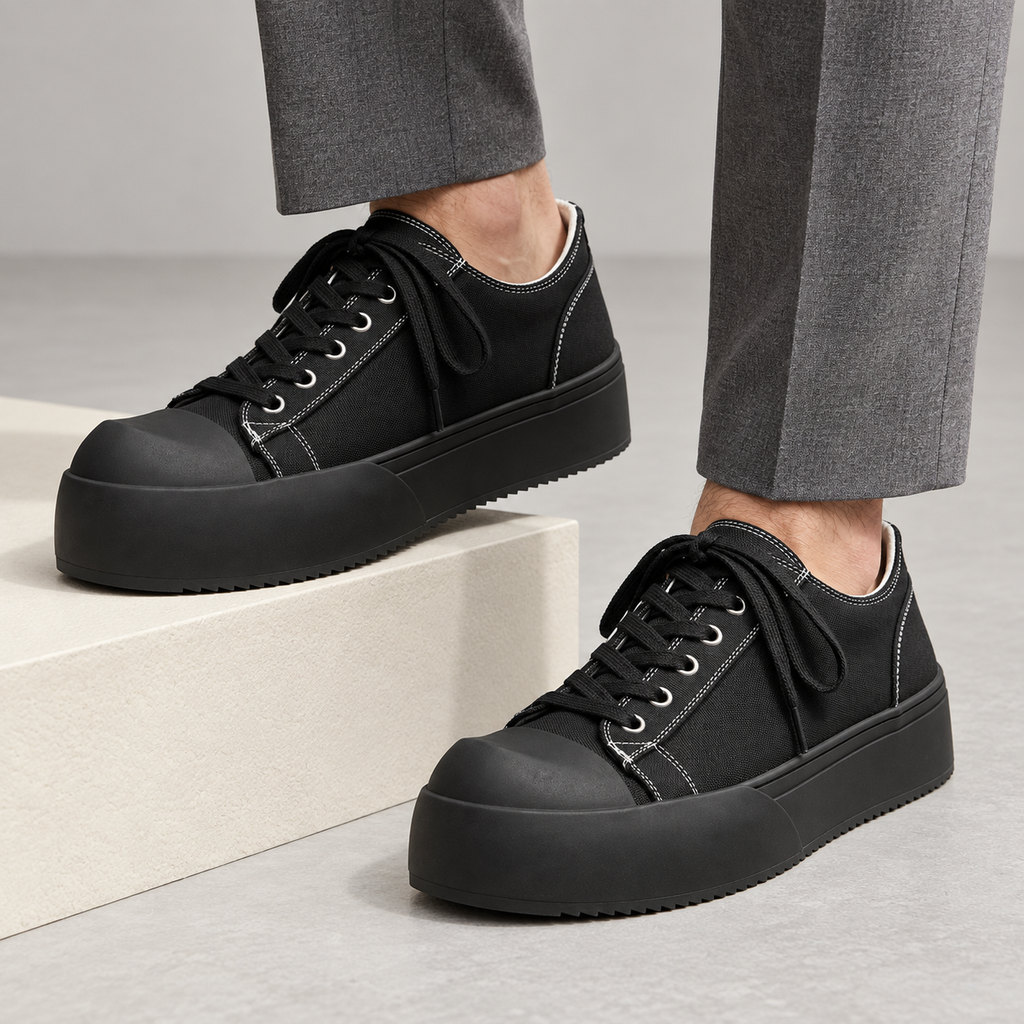 Torino Retro Leather Sneakers — Black — worn view