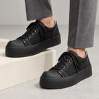 Torino Retro Leather Sneakers — Black — worn view